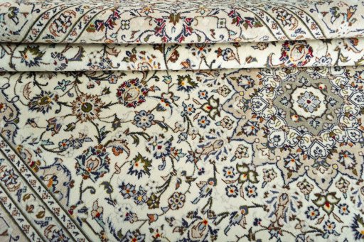 Close-up detail of 2000s Kashan rug from Iran / Persia showing Wool weave