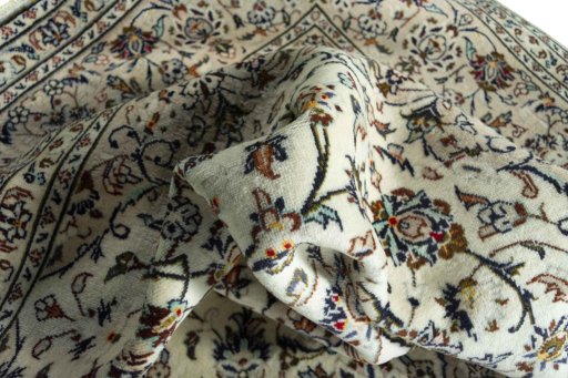 Surface texture of 2000s Kashan rug with natural Wool and intricate pattern
