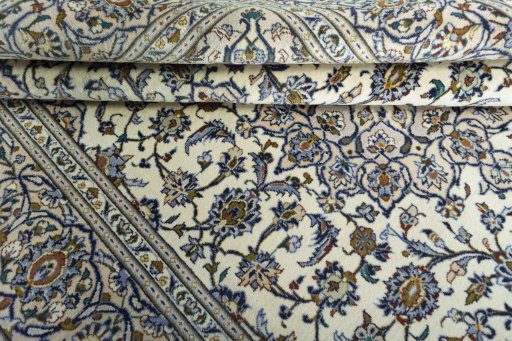 Close-up detail of 2000s Kashan rug from Iran / Persia showing Wool weave