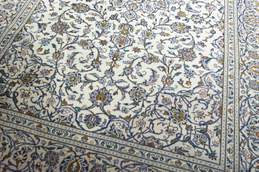 Close-up detail of 2000s Kashan rug from Iran / Persia showing Wool weave