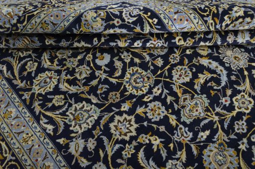 Close-up detail of 2000s Kashan rug from Iran / Persia showing Wool weave