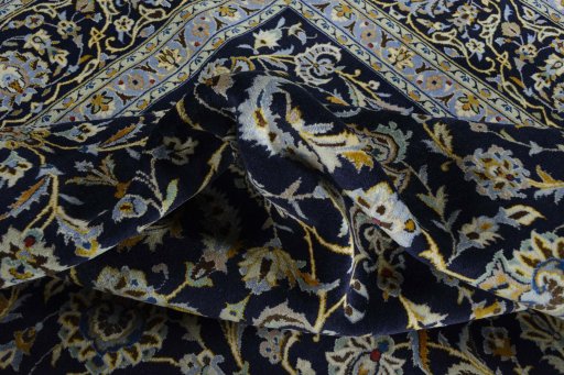 Surface texture of 2000s Kashan rug with natural Wool and intricate pattern