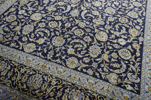Close-up detail of 2000s Kashan rug from Iran / Persia showing Wool weave