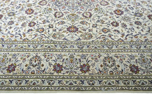 Corner detail of 2000s Kashan rug showing border pattern and Wool pile
