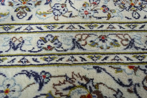 Close-up detail of 2000s Kashan rug from Iran / Persia showing Wool weave