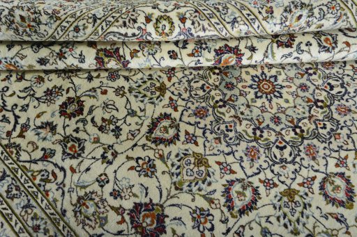 Surface texture of 2000s Kashan rug with natural Wool and intricate pattern