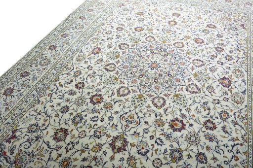 Backside of handmade 2000s Kashan rug showing knot structure and weave density