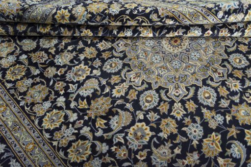 Close-up detail of 2000s Kashan rug from Iran / Persia showing Wool weave