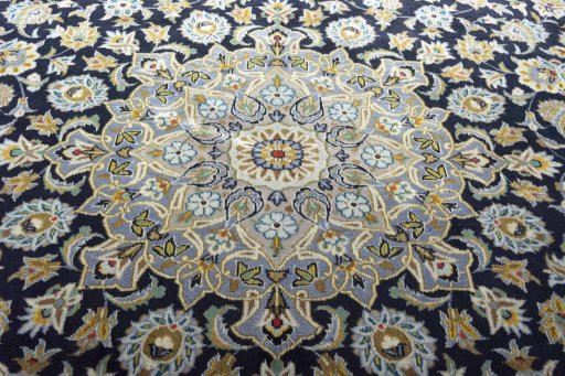 Central medallion detail of 2000s Kashan rug from Iran / Persia