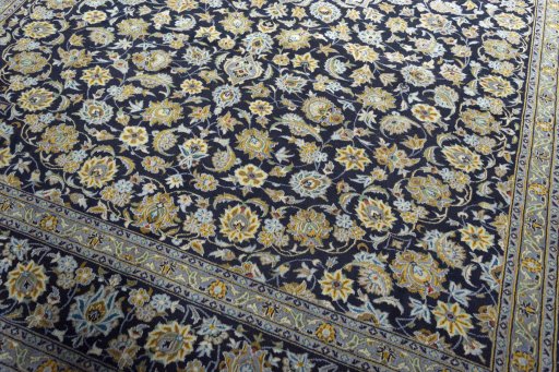Close-up detail of 2000s Kashan rug from Iran / Persia showing Wool weave