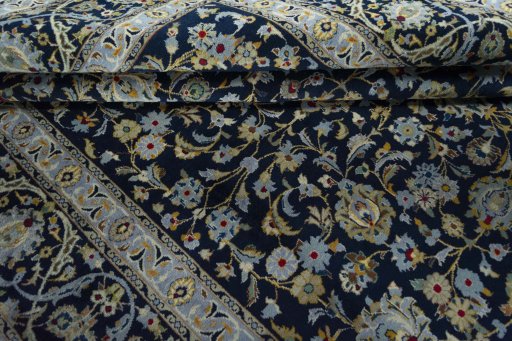 Close-up detail of 2000s Kashan rug from Iran / Persia showing Wool weave