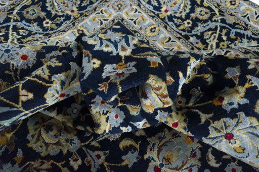 Surface texture of 2000s Kashan rug with natural Wool and intricate pattern