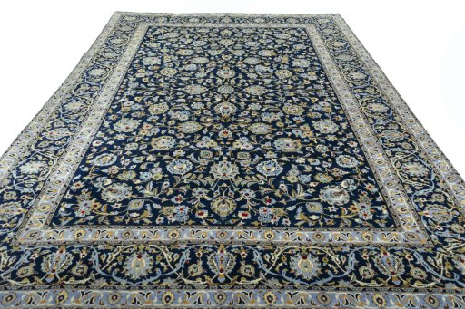 Surface texture of 2000s Kashan rug with natural Wool and intricate pattern