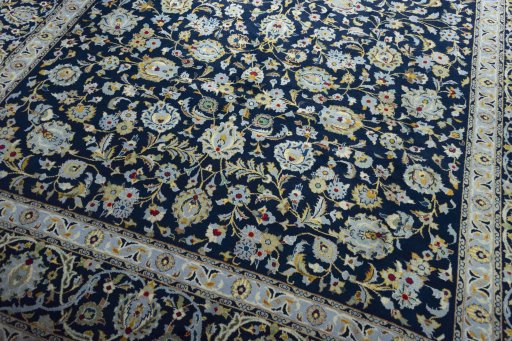 Close-up detail of 2000s Kashan rug from Iran / Persia showing Wool weave
