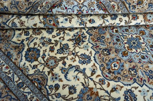Close-up detail of 2000s Kashan rug from Iran / Persia showing Wool weave
