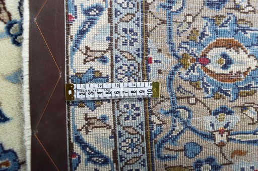 Backside of handmade 2000s Kashan rug showing knot structure and weave density