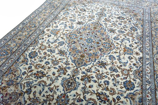 Backside of handmade 2000s Kashan rug showing knot structure and weave density