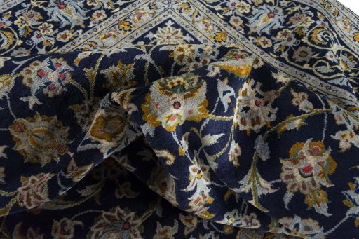 Surface texture of 2000s Kashan rug with natural Wool and intricate pattern