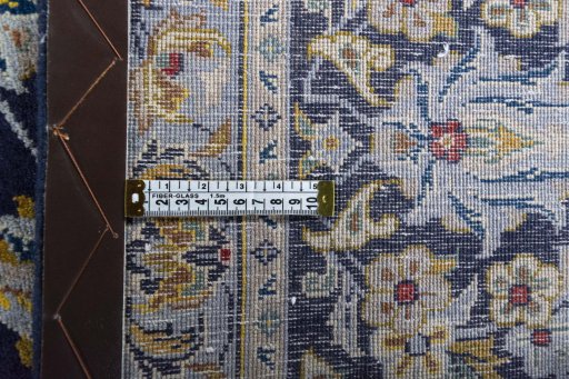 Backside of handmade 2000s Kashan rug showing knot structure and weave density