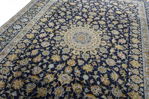 Backside of handmade 2000s Kashan rug showing knot structure and weave density
