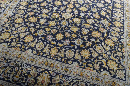 Close-up detail of 2000s Kashan rug from Iran / Persia showing Wool weave