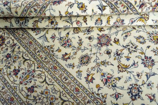 Close-up detail of 2000s Kashan rug from Iran / Persia showing Wool weave