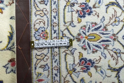 Backside of handmade 2000s Kashan rug showing knot structure and weave density