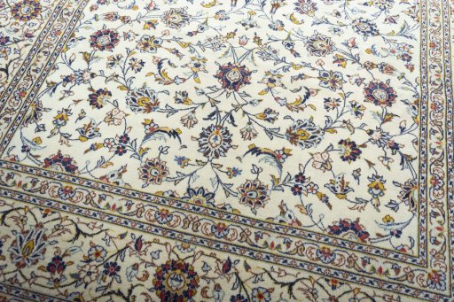 Close-up detail of 2000s Kashan rug from Iran / Persia showing Wool weave