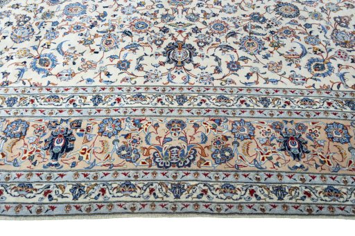 Corner detail of 2000s Kashan rug showing border pattern and Wool pile