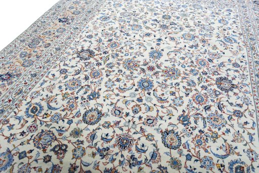 Backside of handmade 2000s Kashan rug showing knot structure and weave density