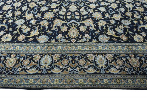 Corner detail of 2000s Kashan rug showing border pattern and Wool pile