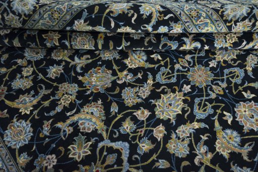Close-up detail of 2000s Kashan rug from Iran / Persia showing Wool weave