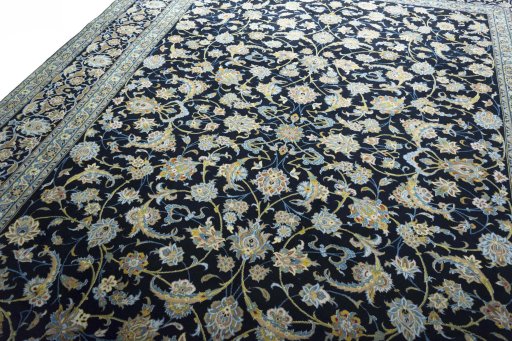 Backside of handmade 2000s Kashan rug showing knot structure and weave density