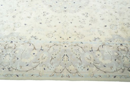 Corner detail of New Kashan rug showing border pattern and Wool pile