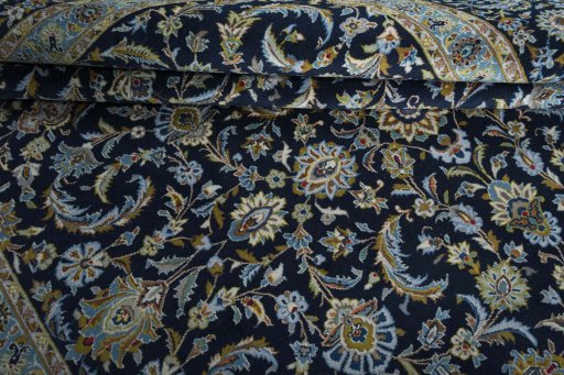Close-up detail of 2000s Kashan rug from Iran / Persia showing Wool weave