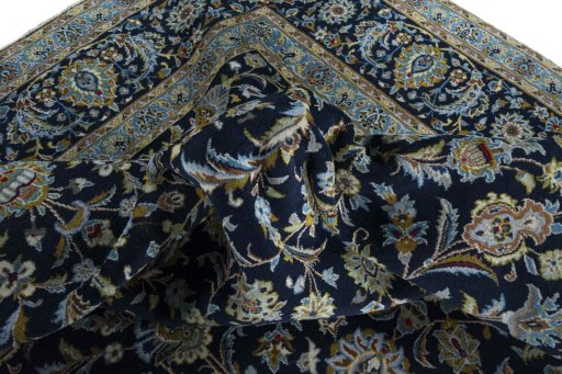 Surface texture of 2000s Kashan rug with natural Wool and intricate pattern