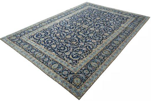 Corner detail of 2000s Kashan rug showing border pattern and Wool pile