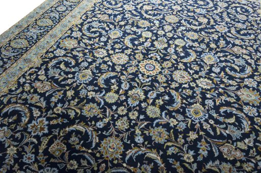 Backside of handmade 2000s Kashan rug showing knot structure and weave density