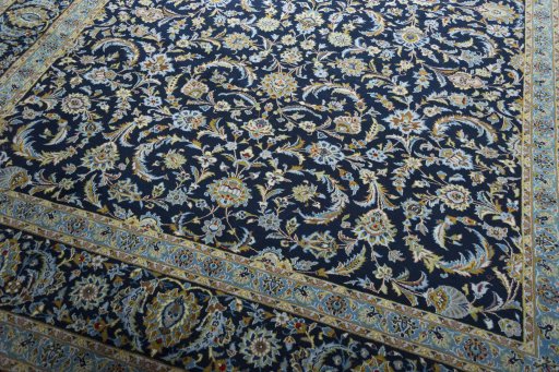 Close-up detail of 2000s Kashan rug from Iran / Persia showing Wool weave