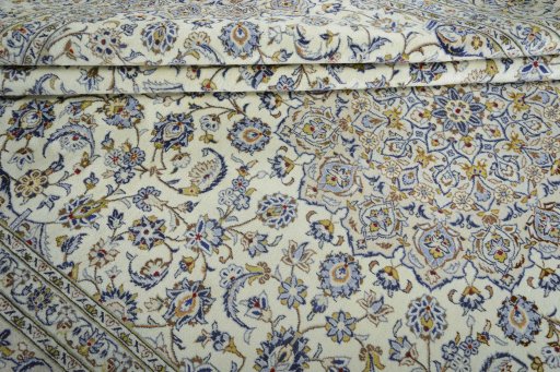 Close-up detail of 2000s Kashan rug from Iran / Persia showing Wool weave