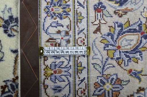Backside of handmade 2000s Kashan rug showing knot structure and weave density