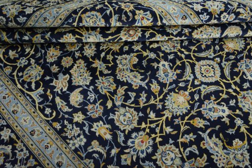 Close-up detail of 2000s Kashan rug from Iran / Persia showing Wool weave