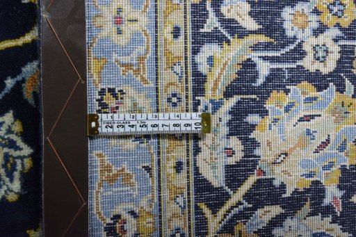 Backside of handmade 2000s Kashan rug showing knot structure and weave density