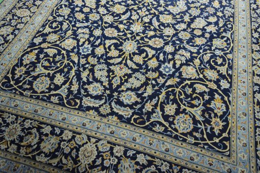 Close-up detail of 2000s Kashan rug from Iran / Persia showing Wool weave