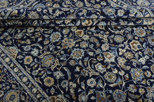 Close-up detail of 2000s Kashan rug from Iran / Persia showing Wool weave