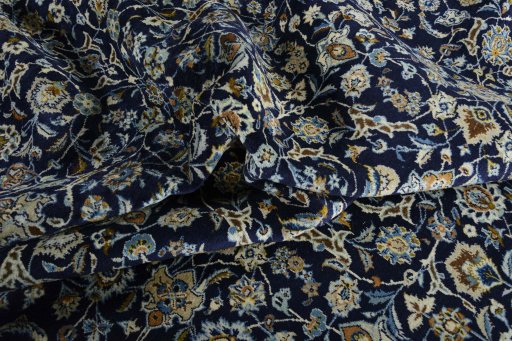 Surface texture of 2000s Kashan rug with natural Wool and intricate pattern