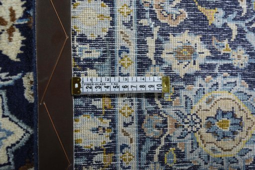 Backside of handmade 2000s Kashan rug showing knot structure and weave density
