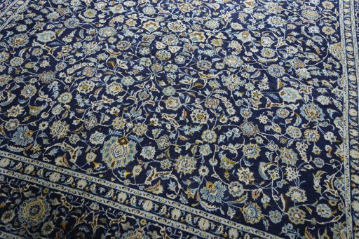 Close-up detail of 2000s Kashan rug from Iran / Persia showing Wool weave