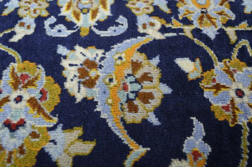 Close-up detail of 2000s Kashan rug from Iran / Persia showing Wool weave