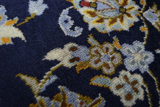 Surface texture of 2000s Kashan rug with natural Wool and intricate pattern